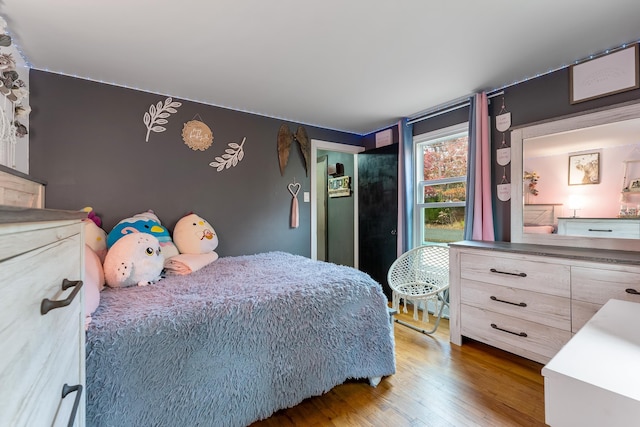 bedroom featuring hardwood / wood-style flooring