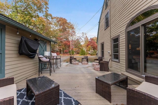 wooden deck featuring an outdoor hangout area