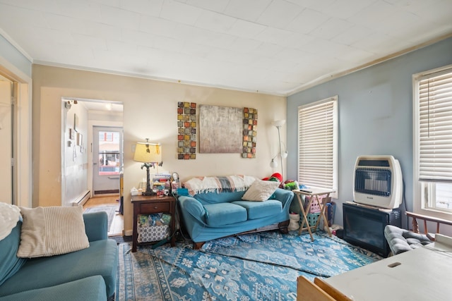 126 W Andrews Ave, Wildwood, NJ 08260 - living area featuring heating unit, plenty of natural light, baseboard heating, and crown molding