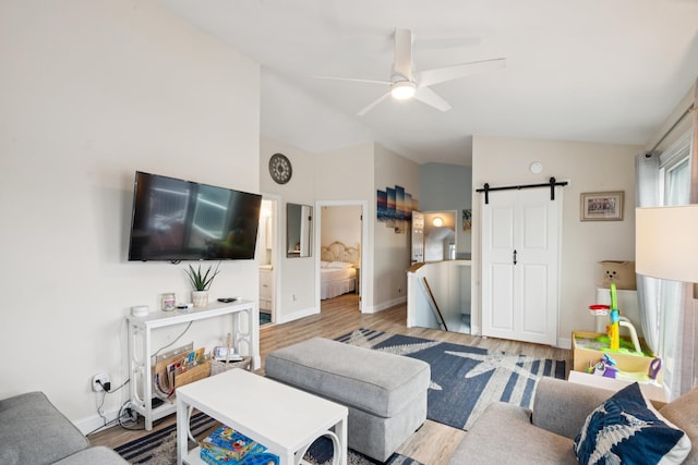 126 W Andrews Ave, Wildwood, NJ 08260 - living area featuring lofted ceiling, wood finished floors, ceiling fan, and a barn door