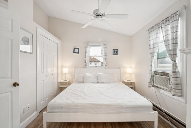 126 W Andrews Ave, Wildwood, NJ 08260 - bedroom with lofted ceiling, wood finished floors, a closet, baseboard heating, and a ceiling fan