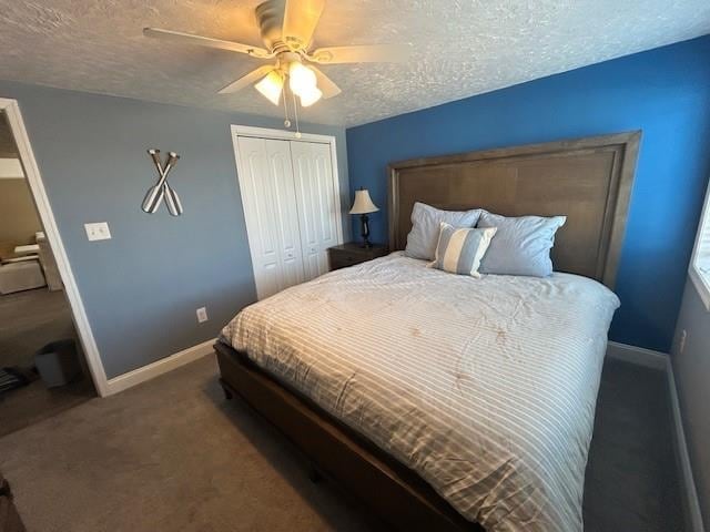 carpeted bedroom featuring a textured ceiling, a closet, a ceiling fan, and baseboards