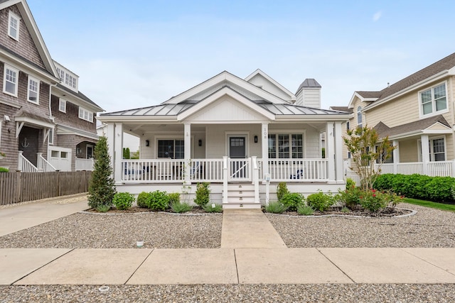 108 27th St, Avalon, NJ 08202 - view of front of house featuring a standing seam roof, covered porch, and metal roof