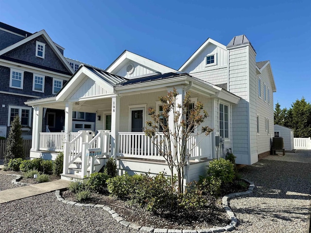 view of front facade with covered porch and board and batten siding