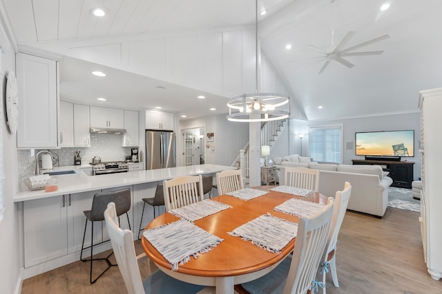 108 27th St, Avalon, NJ 08202 - dining space featuring stairs, lofted ceiling, light wood-style floors, a chandelier, and recessed lighting
