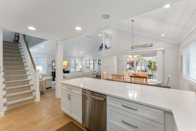 108 27th St, Avalon, NJ 08202 - kitchen with stainless steel dishwasher, lofted ceiling, light wood-type flooring, decorative light fixtures, and white cabinetry