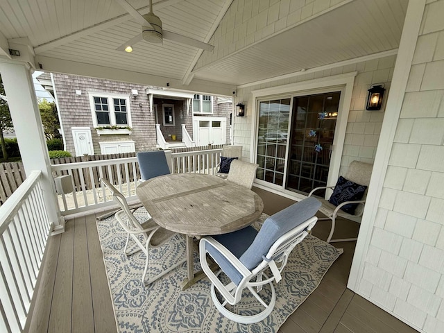 deck featuring a ceiling fan and outdoor dining area