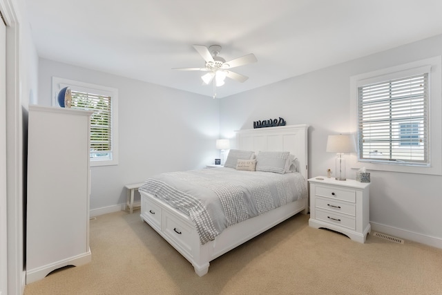 108 27th St, Avalon, NJ 08202 - bedroom with light colored carpet, baseboards, and a ceiling fan