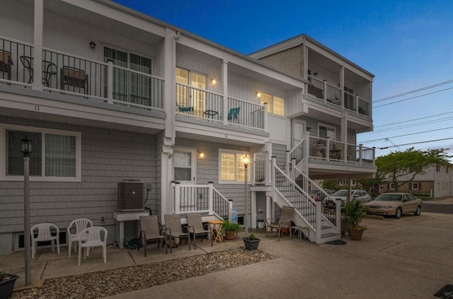309 E Surf Ave Unit 12, North Wildwood, NJ 08260 - back of property with cooling unit, a balcony, and stairs