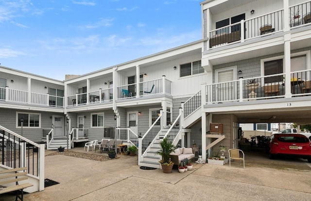 309 E Surf Ave Unit 12, North Wildwood, NJ 08260 - view of building exterior featuring concrete driveway and a carport