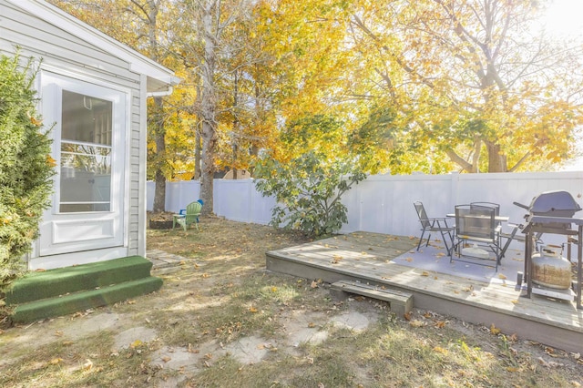 view of yard with a wooden deck