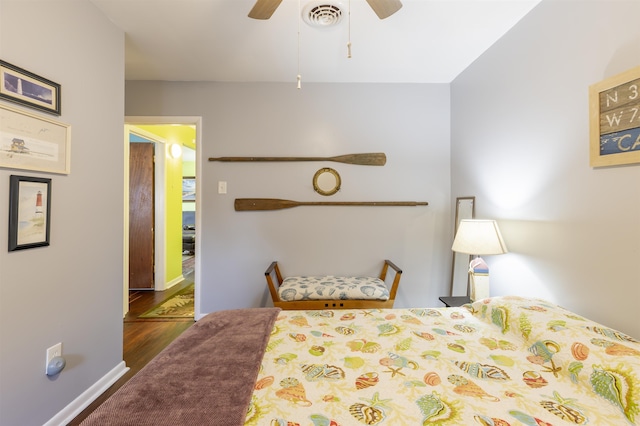 bedroom with ceiling fan and dark hardwood / wood-style floors