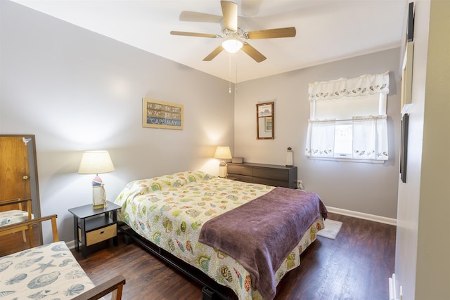 bedroom featuring ceiling fan and dark hardwood / wood-style floors