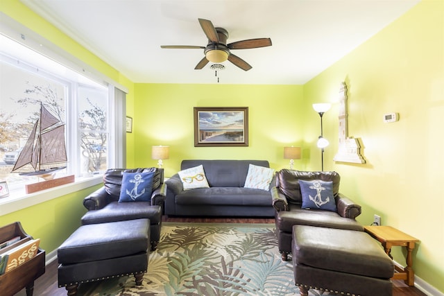 living room featuring hardwood / wood-style flooring and ceiling fan