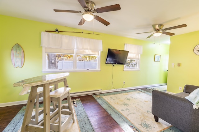 living room with ceiling fan, dark wood-type flooring, and a baseboard radiator