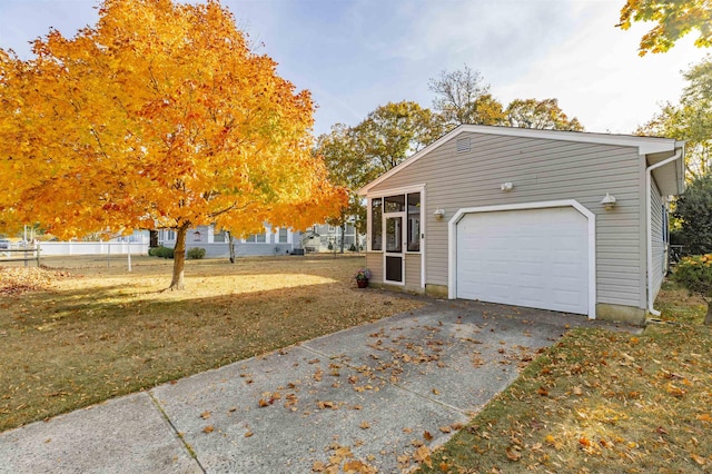 view of property exterior with a lawn and a garage