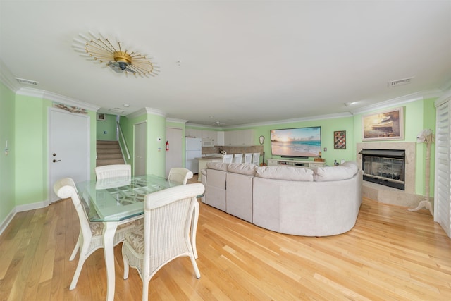 902 Ocean Dr Unit 306, Lower Township, NJ 08204 - dining area with light wood-type flooring, ornamental molding, and visible vents