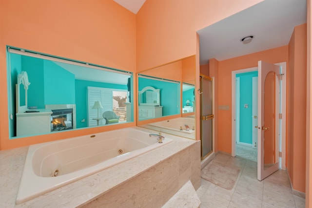 902 Ocean Dr Unit 306, Lower Township, NJ 08204 - bathroom with a whirlpool tub, baseboards, and a shower stall