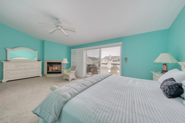 902 Ocean Dr Unit 306, Lower Township, NJ 08204 - bedroom with a multi sided fireplace, a ceiling fan, carpet, access to exterior, and lofted ceiling