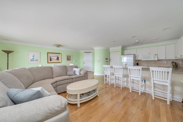 902 Ocean Dr Unit 306, Lower Township, NJ 08204 - living area with ornamental molding, baseboards, and light wood-type flooring
