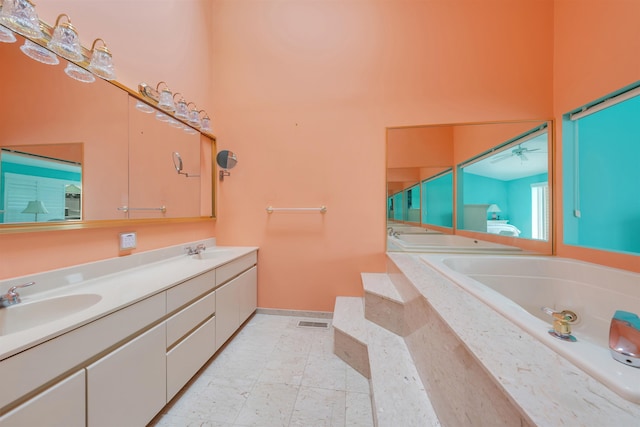 902 Ocean Dr Unit 306, Lower Township, NJ 08204 - full bathroom with double vanity, a sink, a tub with jets, and visible vents