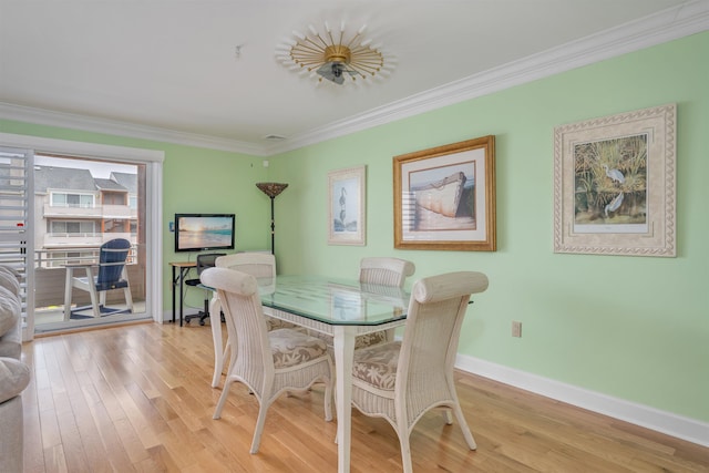 902 Ocean Dr Unit 306, Lower Township, NJ 08204 - dining space with wood finished floors, baseboards, and ornamental molding