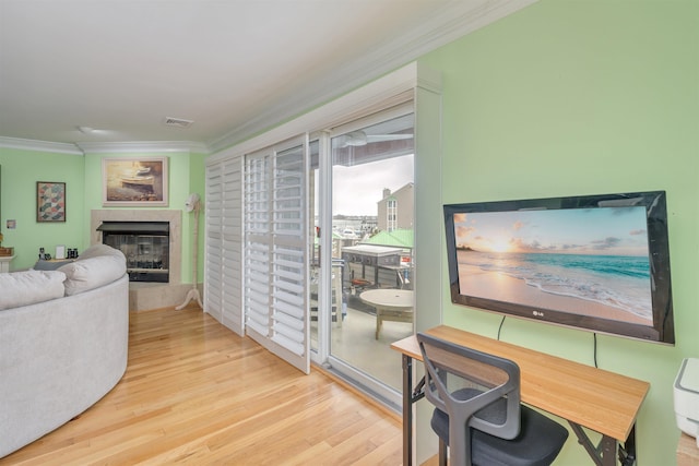 902 Ocean Dr Unit 306, Lower Township, NJ 08204 - living room featuring a fireplace with raised hearth, visible vents, crown molding, and wood finished floors