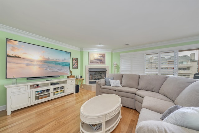 902 Ocean Dr Unit 306, Lower Township, NJ 08204 - living area with light wood-style floors, a glass covered fireplace, ornamental molding, and visible vents