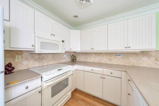 902 Ocean Dr Unit 306, Lower Township, NJ 08204 - kitchen with white appliances, light countertops, visible vents, decorative backsplash, and light wood finished floors