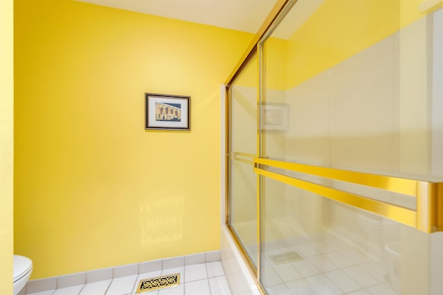 902 Ocean Dr Unit 306, Lower Township, NJ 08204 - bathroom with baseboards, tile patterned flooring, toilet, visible vents, and a shower with shower door