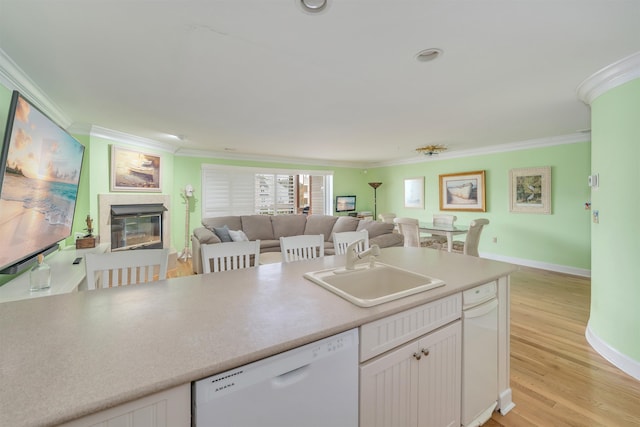 902 Ocean Dr Unit 306, Lower Township, NJ 08204 - kitchen with dishwasher, a sink, ornamental molding, open floor plan, and white cabinetry