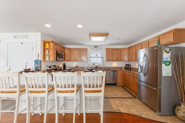 117 W Spicer Ave Unit A, Wildwood, NJ 08260 - kitchen featuring appliances with stainless steel finishes, open shelves, a kitchen bar, a peninsula, and recessed lighting