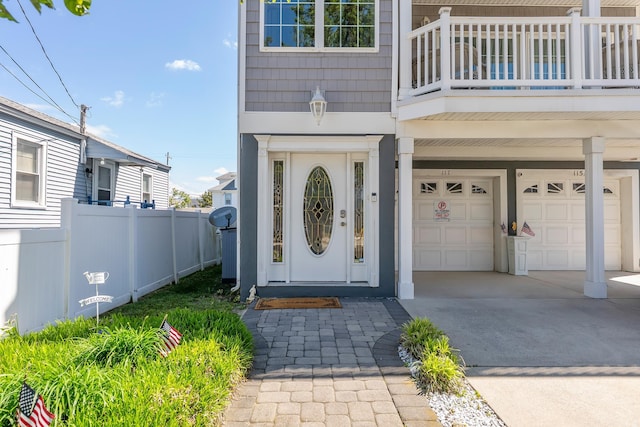 117 W Spicer Ave Unit A, Wildwood, NJ 08260 - view of exterior entry with an attached garage, a balcony, and concrete driveway
