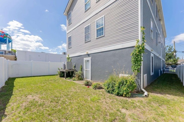 117 W Spicer Ave Unit A, Wildwood, NJ 08260 - view of side of home featuring stucco siding and central AC unit