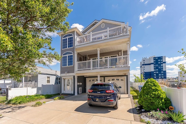 117 W Spicer Ave Unit A, Wildwood, NJ 08260 - view of front of home featuring a balcony, concrete driveway, and an attached garage