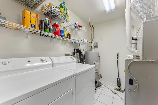 117 W Spicer Ave Unit A, Wildwood, NJ 08260 - laundry room with gas water heater, washing machine and dryer, light tile patterned floors, heating unit, and baseboards