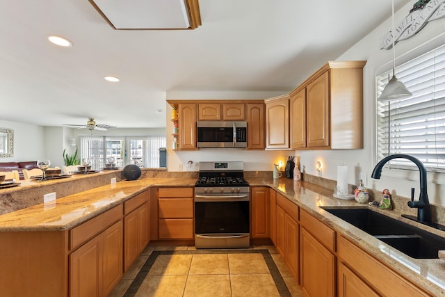 117 W Spicer Ave Unit A, Wildwood, NJ 08260 - kitchen with appliances with stainless steel finishes, a sink, recessed lighting, light stone counters, and a peninsula