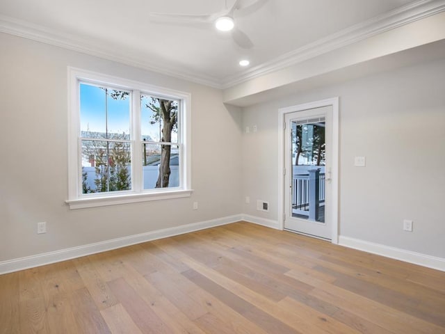 spare room with crown molding, ceiling fan, and light hardwood / wood-style floors