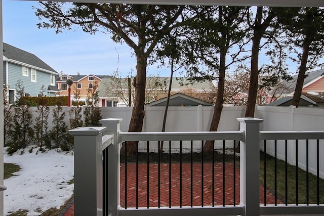 view of snow covered gate