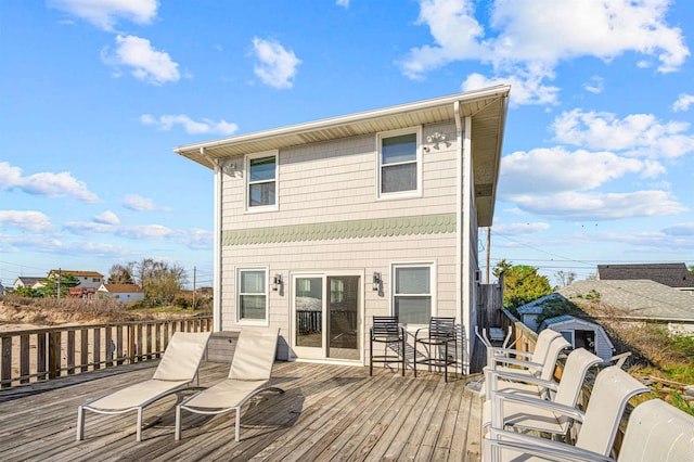 back of house featuring a wooden deck