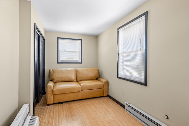 94 Delaware Ave, Fortescue, NJ 08321 - sitting room featuring baseboards, a baseboard radiator, and light wood-style flooring