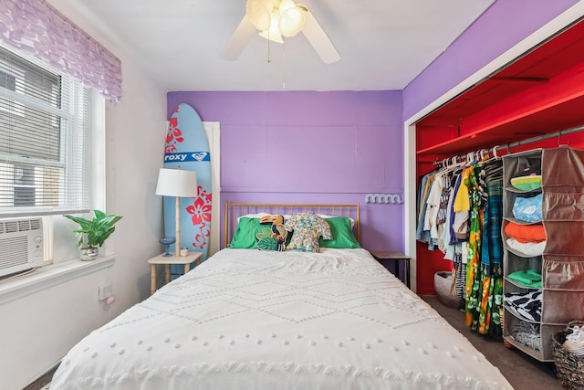 bedroom featuring ceiling fan, dark carpet, and a closet