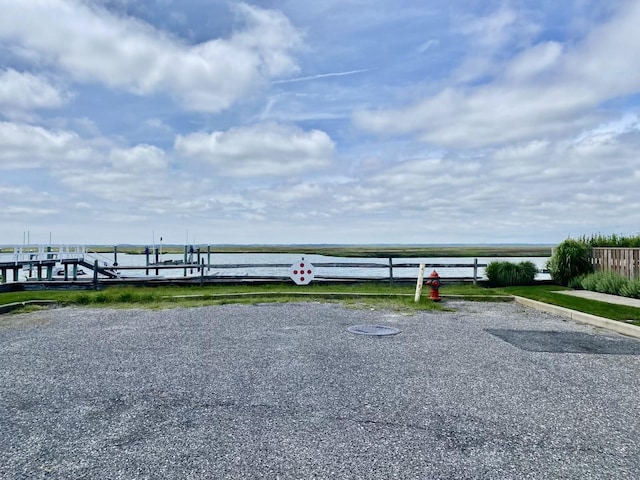 6772 Ocean Dr Unit 6772, Avalon, NJ 08202 - view of vehicle parking featuring a water view