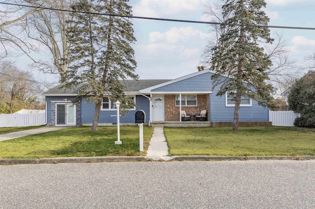 view of front of house with a porch and a front yard