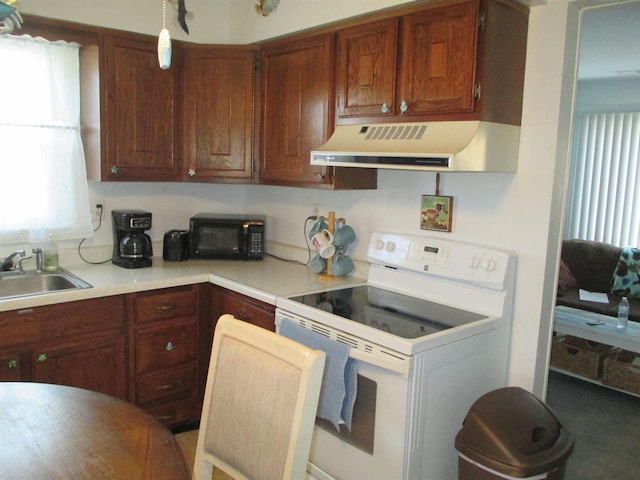 kitchen featuring white range with electric stovetop, sink, and range hood