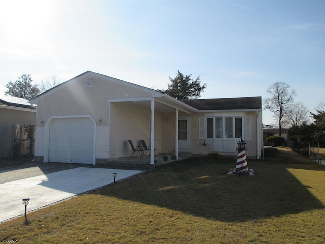 single story home featuring a garage and a front yard