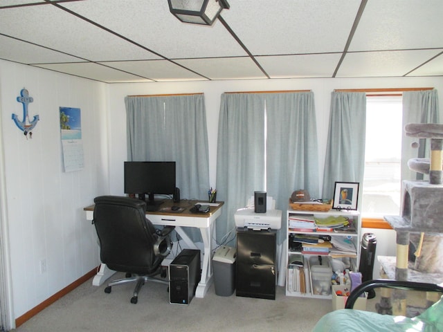 home office with a paneled ceiling and carpet floors