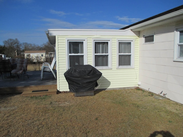 exterior space with a lawn and a deck