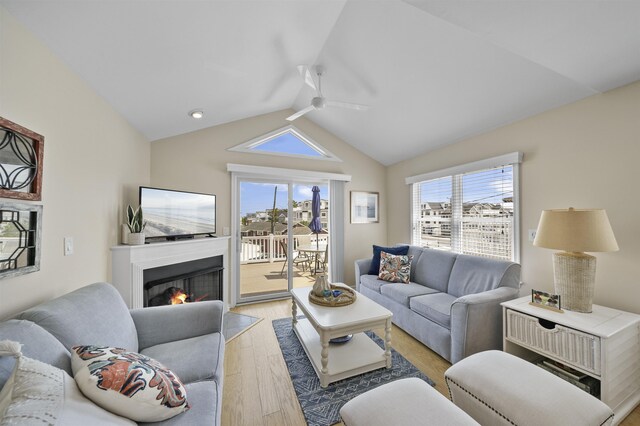 2026 6th Ave Unit S, Avalon, NJ 08202 - living area with ceiling fan, light wood-style flooring, vaulted ceiling, and a lit fireplace