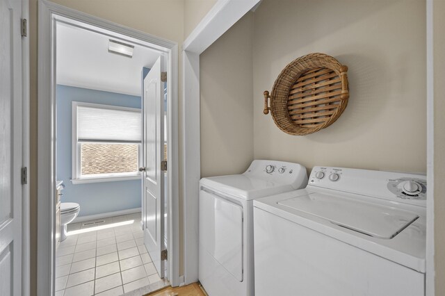 2026 6th Ave Unit S, Avalon, NJ 08202 - laundry area with washer and dryer, light tile patterned floors, and baseboards